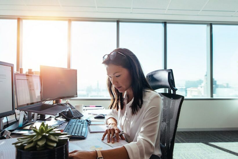A businesswoman working in finance with her bachelor’s in business administration.
