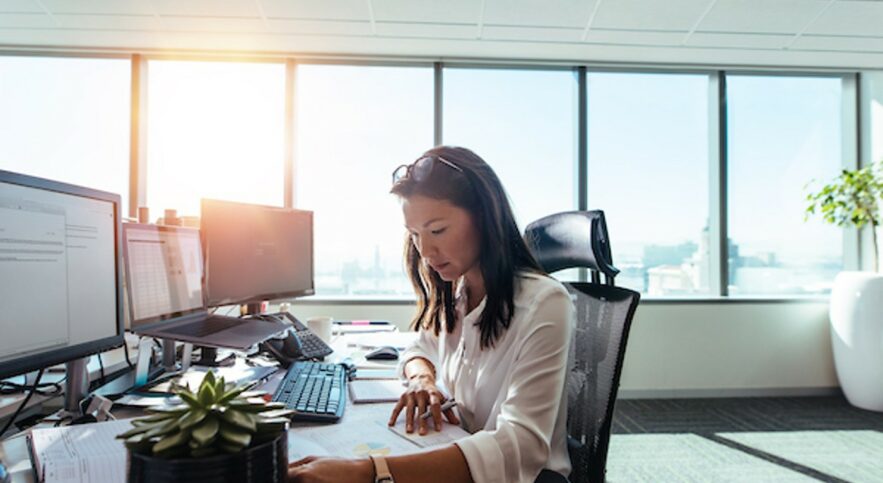 A businesswoman working in finance with her bachelor’s in business administration.