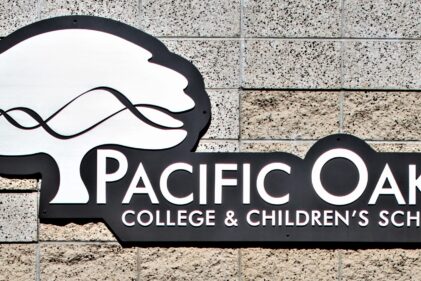 Close up of Pacific Oaks College sign on building